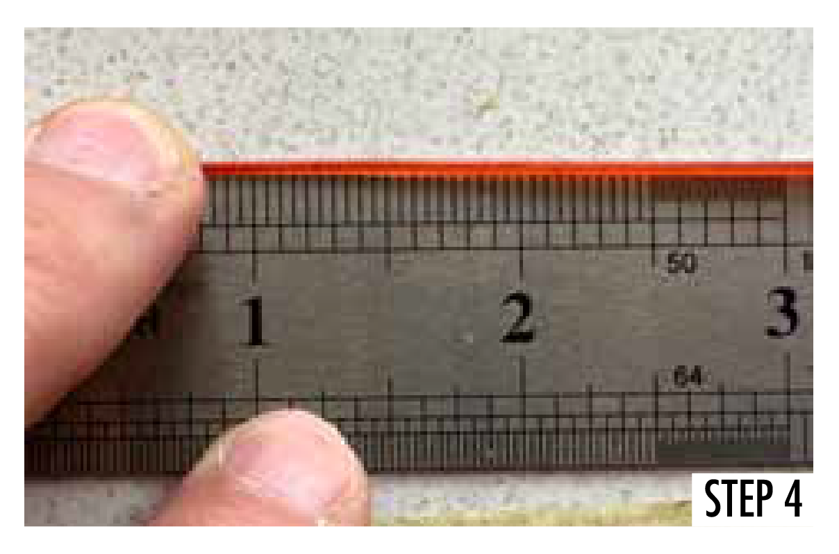 Measuring line flat against a steel ruler